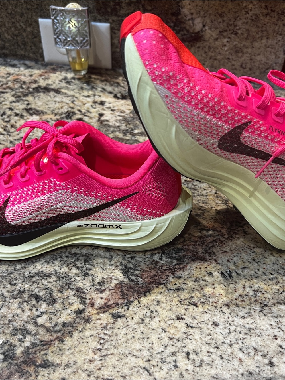 Nike Women’s Hot Pink Flyknit ZoomX Running Shoes with Black Swoosh